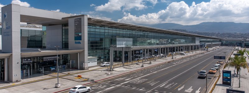 Wide view of Jorge Chávez International Airport (LIM) terminal with signage for Arrivals and Departures
