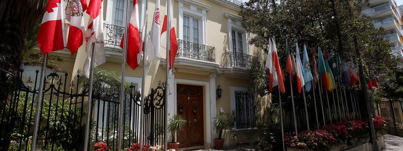 Flags outside an embassy building in Lima’s diplomatic district