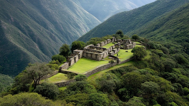 Terraced ruins of Choquequirao surrounded by green mountains