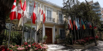 Flags outside an embassy building in Lima’s diplomatic district