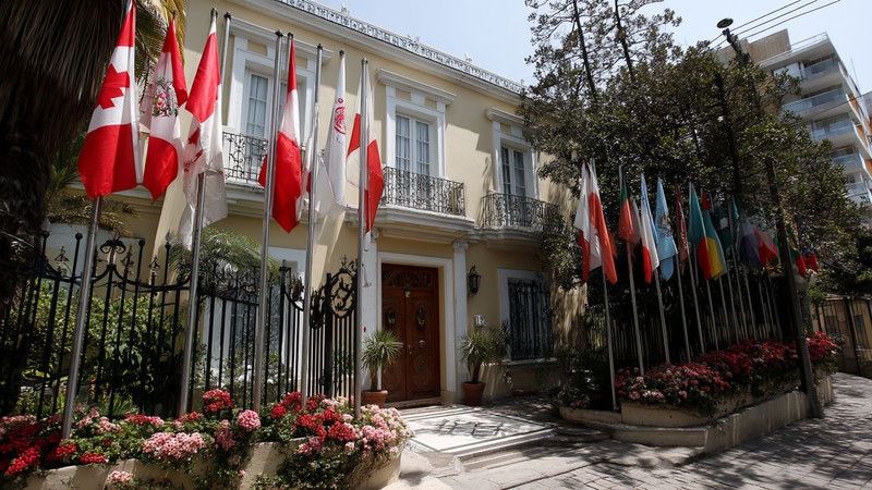 Flags outside an embassy building in Lima’s diplomatic district