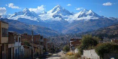 Snow‑capped peaks of the Cordillera Blanca rising above Huaraz city in the Callejón de Huaylas