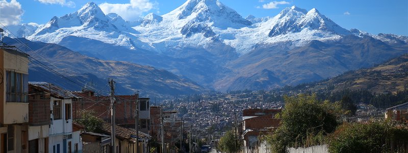 Snow‑capped peaks of the Cordillera Blanca rising above Huaraz city in the Callejón de Huaylas