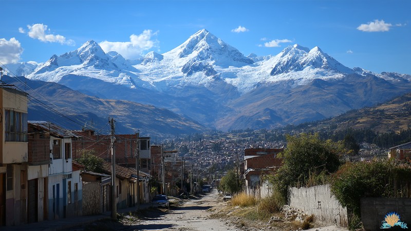 Snow‑capped peaks of the Cordillera Blanca rising above Huaraz city in the Callejón de Huaylas