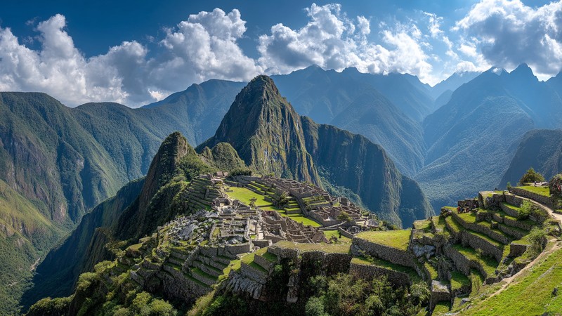 Panoramic view of Machu Picchu from above with Huayna Picchu and Machu Picchu Mountain in the background