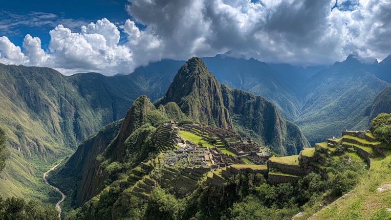 Panoramic view of Machu Picchu from above with Huayna Picchu and Machu Picchu Mountain in the background