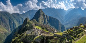 Panoramic view of Machu Picchu from above with Huayna Picchu and Machu Picchu Mountain in the background