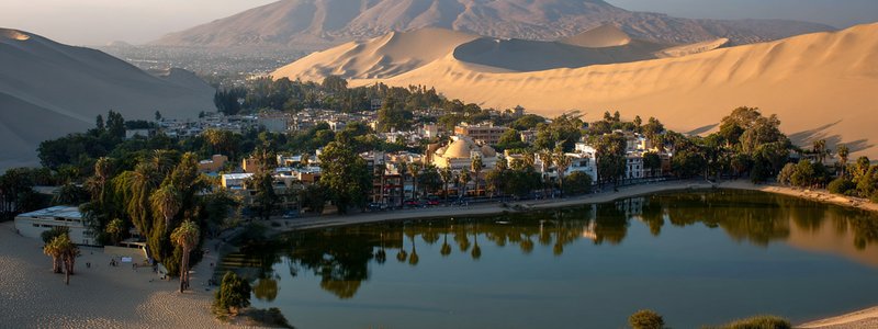 The oasis of Huacachina surrounded by sand dunes near Ica, Peru