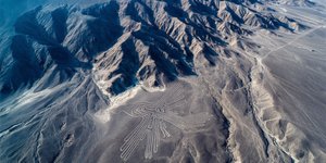 Aerial view of the hummingbird geoglyph among the Nazca Lines
