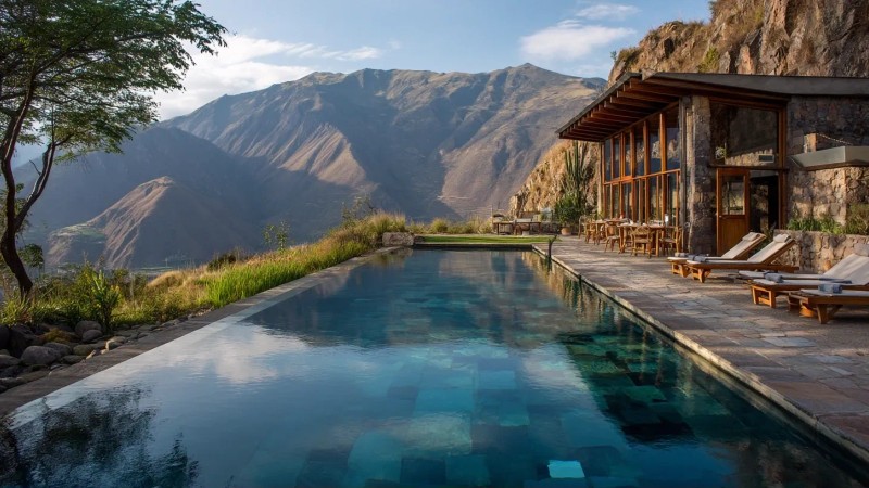 Luxury eco-lodge overlooking Sacred Valley with infinity pool, spa treatments, and gourmet dining setup against Andean mountain backdrop