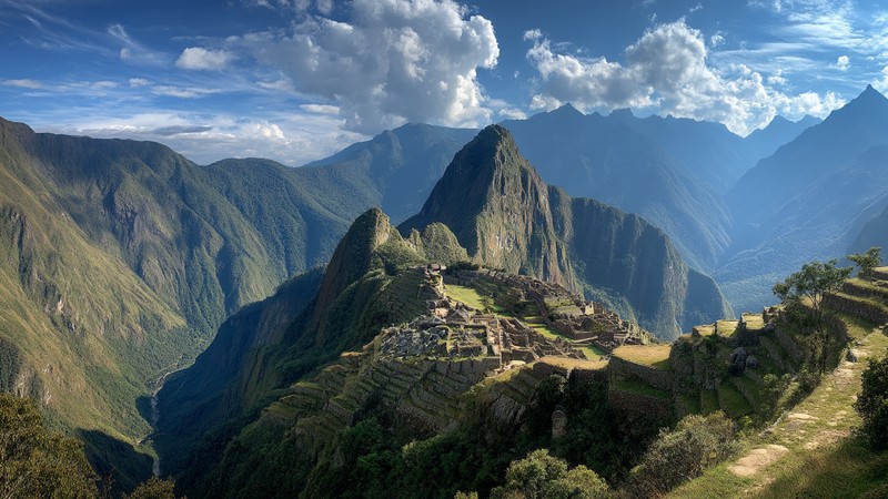 Panoramic view of Machu Picchu perched on a mountain ridge with Huayna Picchu in the background