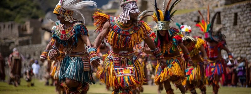 Cultural festivals around Machu Picchu featuring traditional Andean music and dance performances, colorful indigenous costumes, ancient ceremonies at archaeological sites, local artisans displaying crafts, and community celebrations with mountain backdrops