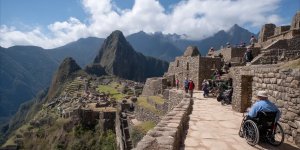 Disabled accessibility at Machu Picchu showing wheelchair-accessible viewing areas, mobility assistance equipment, accessible transportation options, and diverse travelers with various disabilities enjoying the ancient citadel with appropriate support