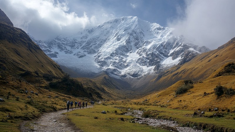 Snowy Salkantay mountain looming over trekkers on the trail