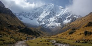 Snowy Salkantay mountain looming over trekkers on the trail