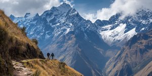 Hikers Pass on the Inca Trail with mountain scenery toward machupiccu