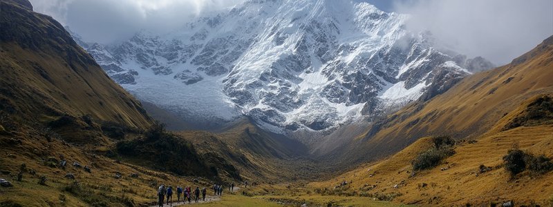 Snowy Salkantay mountain looming over trekkers on the trail