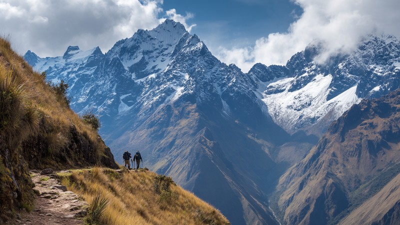 Hikers Pass on the Inca Trail with mountain scenery toward machupiccu