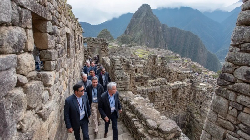 Business professionals visiting Machu Picchu during corporate retreats, wearing business attire while exploring ancient ruins, participating in team building activities, and balancing work responsibilities with cultural experiences