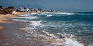 Serene beach view of Zorritos with golden sands and gentle waves